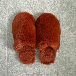 Fuzzy burnt orange slippers